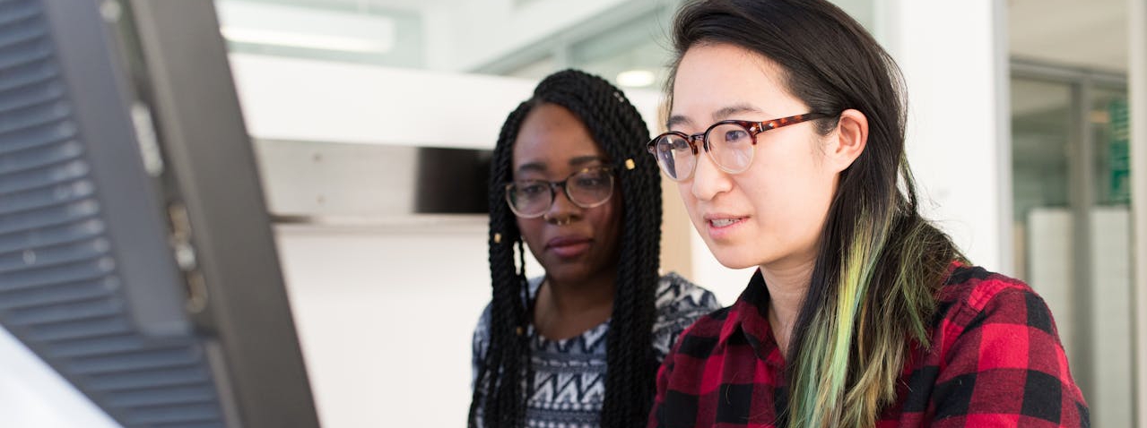 Staff working on a computer